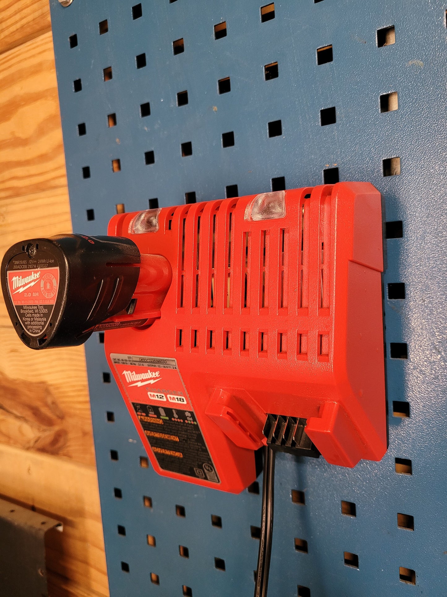 Milwaukee M12 M18 Charger Mount, Cat. No. 48-59-1812, Uses Two Neodymium Bar Magnets for Strong Hold on Metal Surface